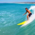 Josh Kerr surfing a wave, promoting ocean conservation efforts.